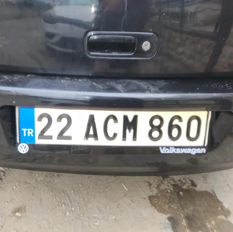 Installation of the new Volkswagen logo plate holders.